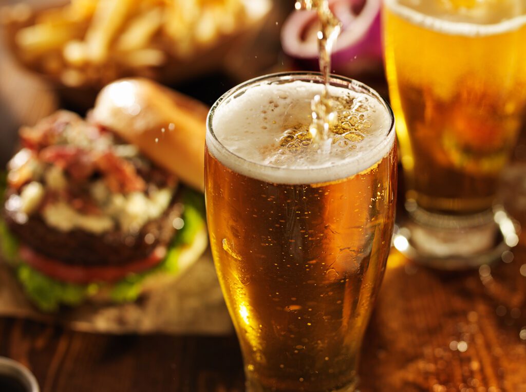 Beer-poured-next-to-a-buger